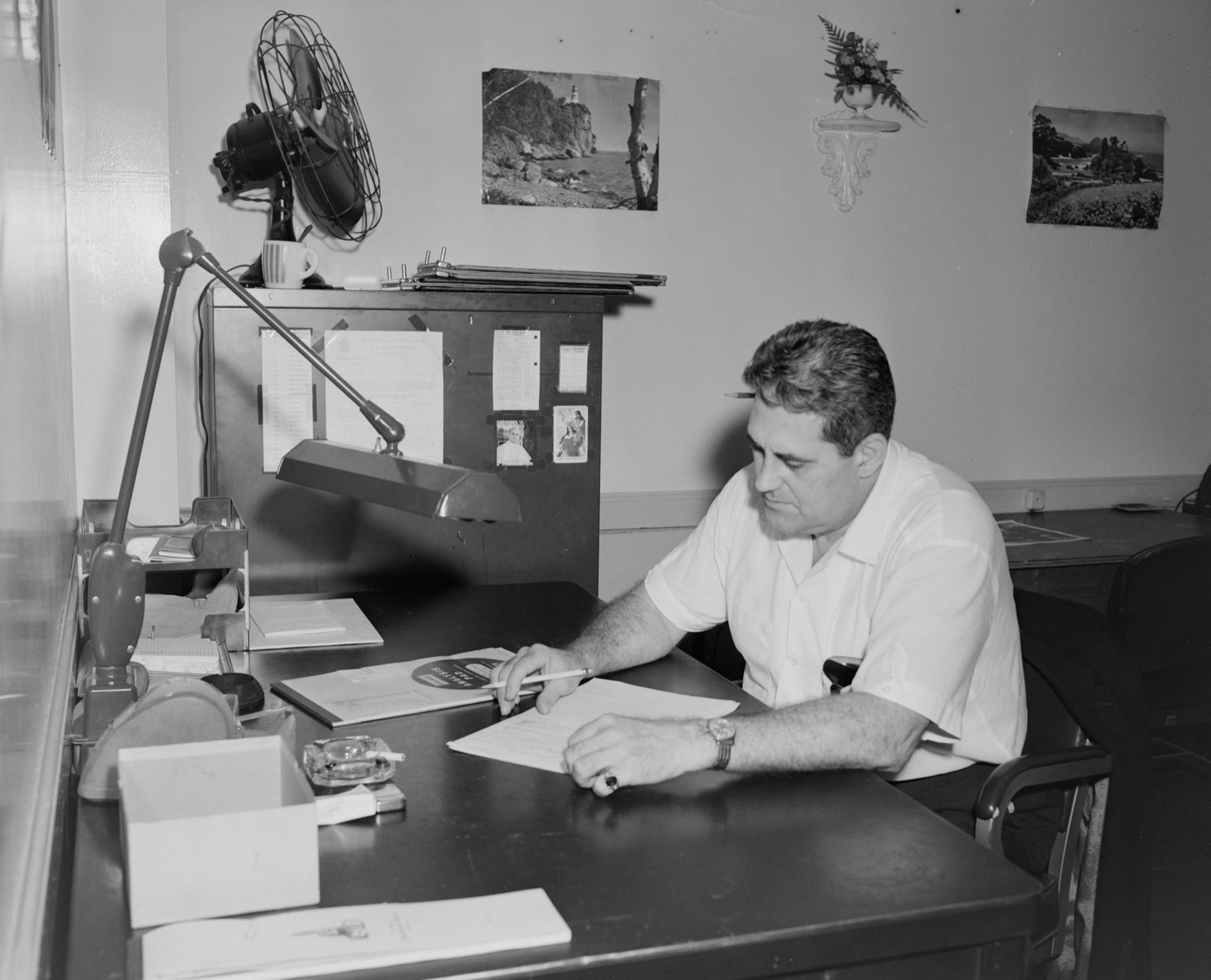 Person reviewing documents at a desk